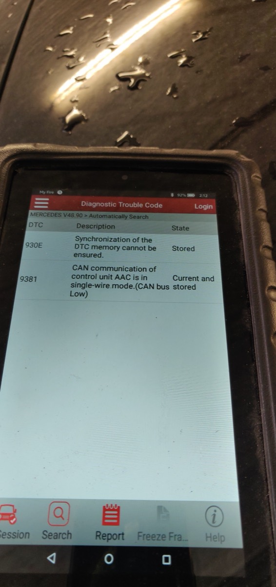 A handheld diagnostic scanner showing stored Mercedes fault codes during an auto-electrical diagnostic at Samet Auto Electrics.
