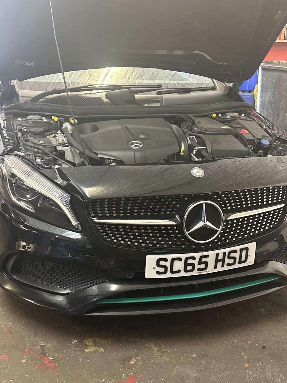 A Mercedes engine bay with the bonnet raised, being checked over during auto-electrical work at Samet Auto Electrics.